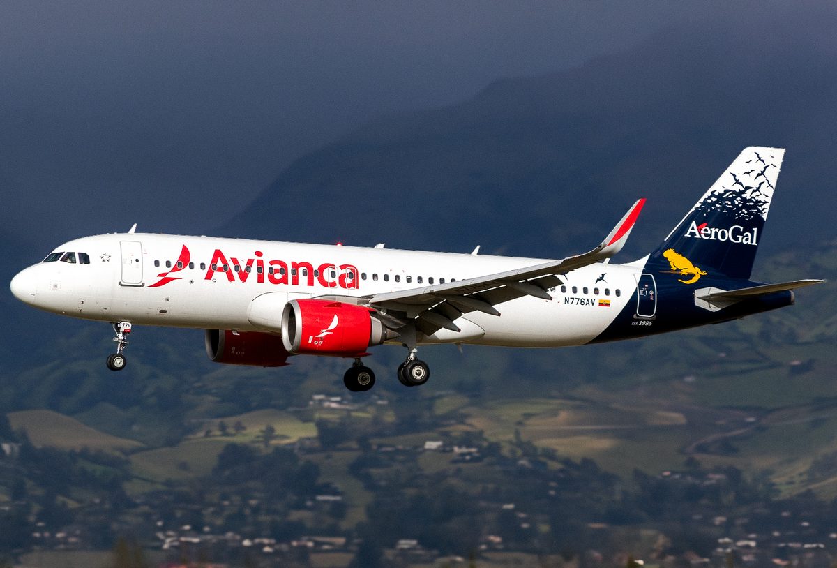 Airbus A320-200 on final approach, showing round engine nacelles and sharklet wingtips
