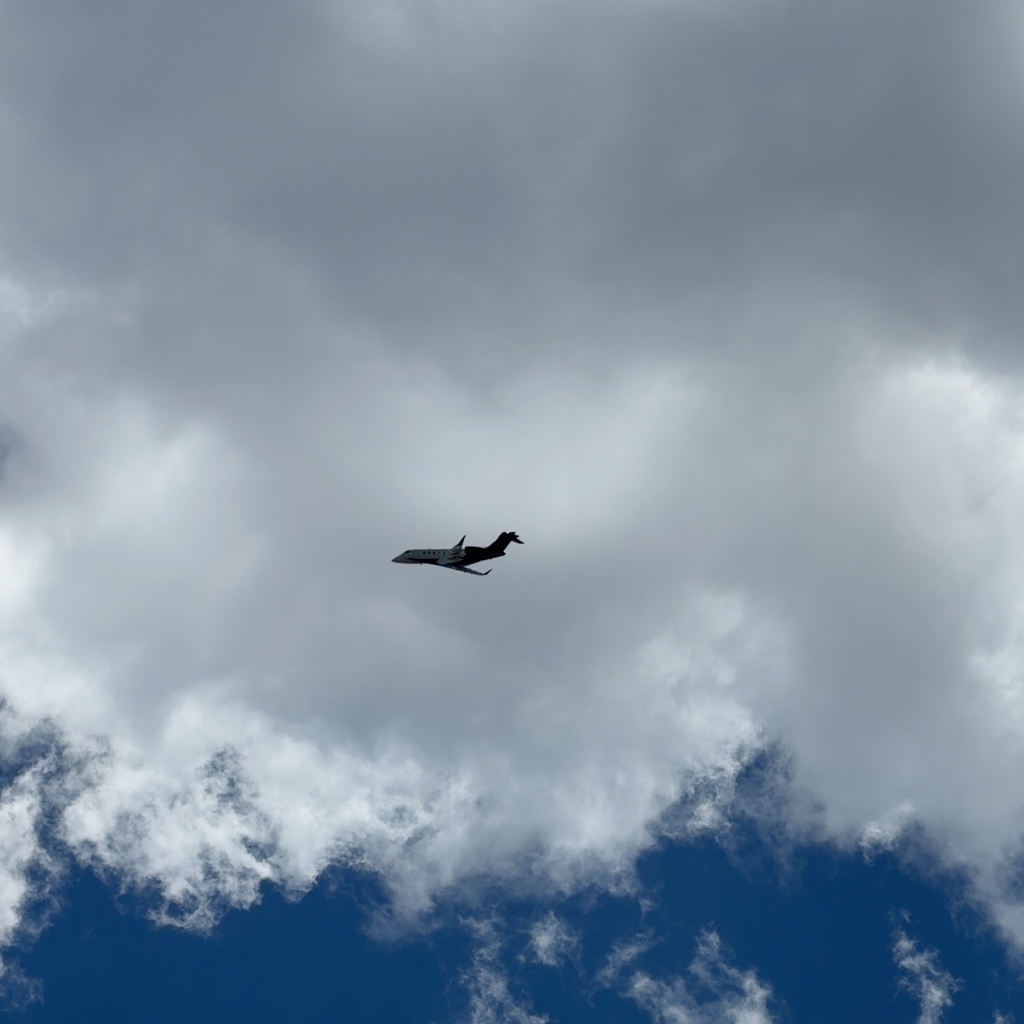 Bombardier Challenger 350 N732AS climbing through clouds near Denver, flying as Airshare XSR732