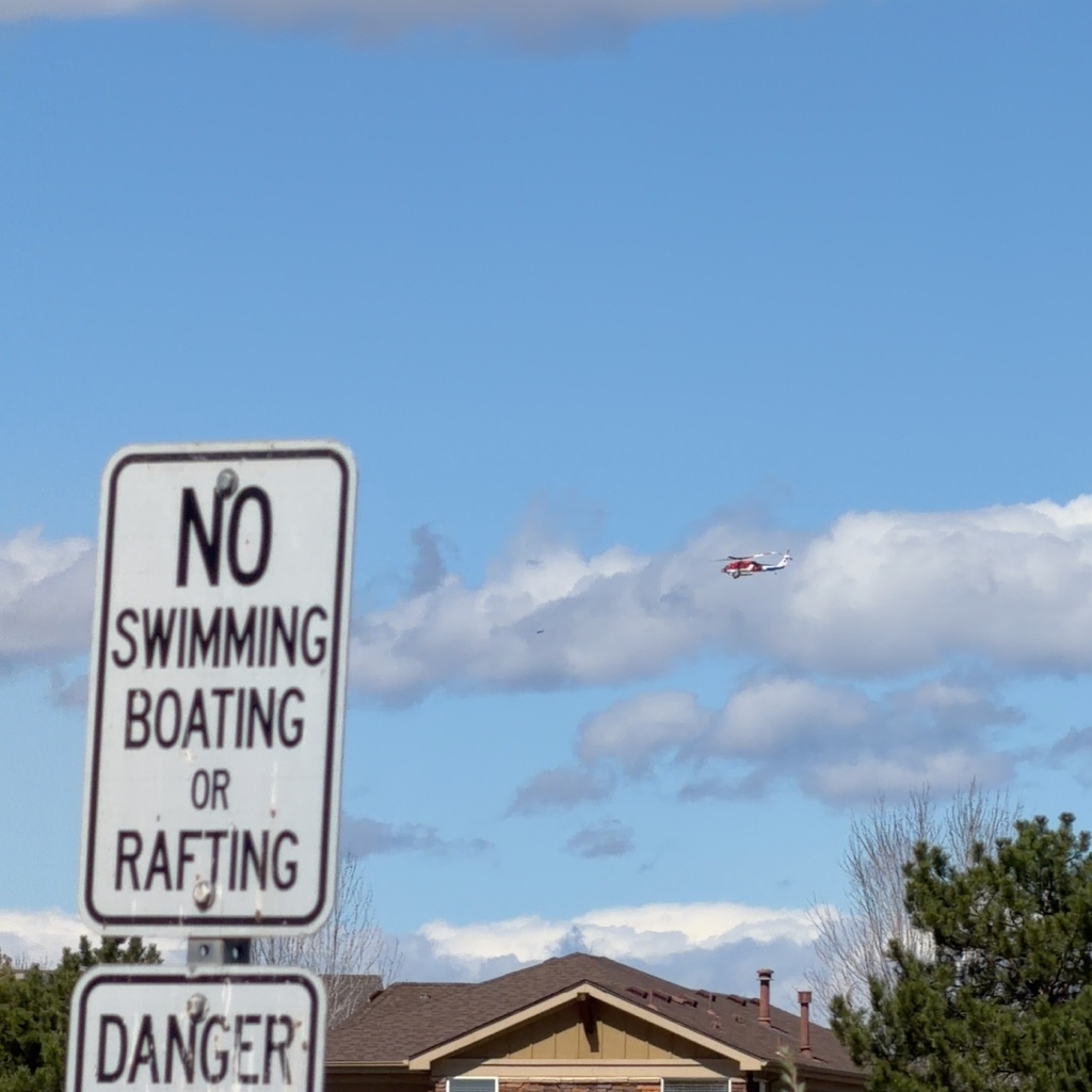 Firefighting Sikorsky Black Hawk helicopter N3802C in red and white livery over Broomfield Colorado